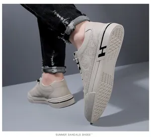 Détail de basket beige respirante pour homme avec logo J&L SPORT et semelle design H