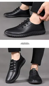 Detailed view of black matte leather loafers with anti-slip rubber soles and fine texture
