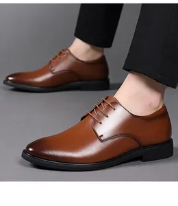Detail of brown leather derby shoes with polished finish and classic lace-up closure