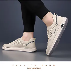 Detail view of beige perforated leather sneakers showing breathable side vents and thick soles
