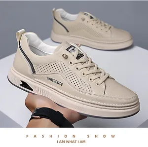 Detail view of breathable laser-cut hollow pattern on beige casual men's loafers