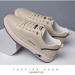 Detail of breathable perforated leather texture and stitch on beige casual men sneakers