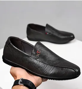 Macro detail of men's leather loafer featuring non-slip rubber sole and textured finish