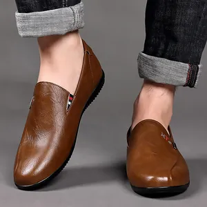 Men's brown leather loafers with metal detail and non-slip rubber sole for casual wear