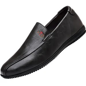 Men's black leather loafers with non-slip rubber soles and metallic buckle details