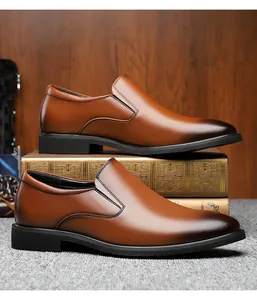 Detail of men's brown slip-on leather shoes with gradient toe on vintage books