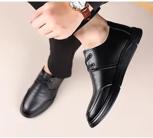 Close-up of black leather business shoes with non-slip thick soles and lace-up design