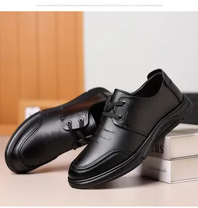 Detail of men's black leather shoes with lychee grain texture and non-slip rubber soles