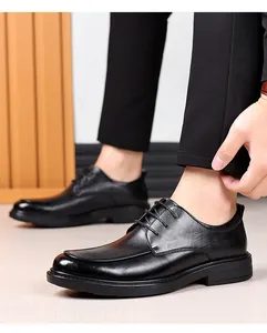 Close-up of black leather business shoes with elegant laces and formal texture
