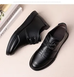 Macro shot of black leather business shoe showing lace-up detail and Sport embossing