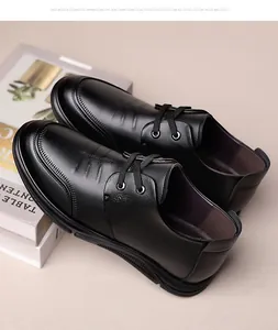 Detail of black leather dress shoe featuring non-slip rubber sole and lacing close-up