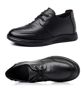 Close-up of black leather business shoes with fine double stitching and lace-up design