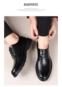 Detail of premium black leather dress shoe with crocodile texture and lace-up design