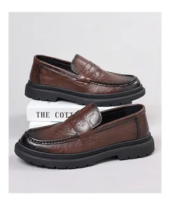 Detail of dark brown leather loafers with hand-stitched seams and anti-slip rubber soles