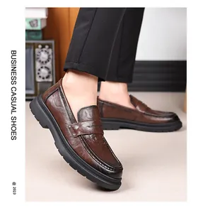 Detail of dark brown leather loafers with vintage finish and premium stitching detail