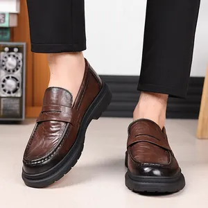 Classic dark brown leather loafers with thick rubber sole and vintage wax finish for men