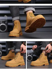 Close-up of yellow work boots featuring durable non-slip rubber soles and suede finish