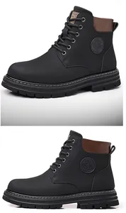 Detailed side view of black high-top work boots with brown leather collar and stitching