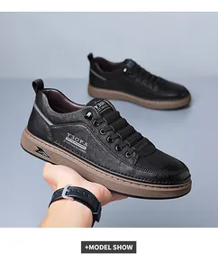 Close-up of black pebble leather men shoes with durable brown rubber sole and wax laces