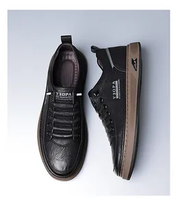 Close-up of black leather casual shoe showing premium lychee texture and thick brown sole