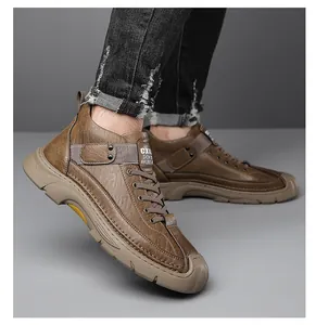 Detailed view of dark brown leather outdoor boot with thick anti-slip rubber sole