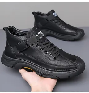 Macro shot of men's black high-top leather shoe with reinforced toe and anti-slip sole