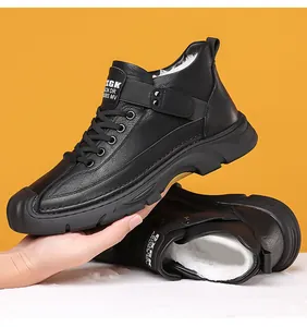 Detail view of black high-top outdoor boots with thick faux fur lining for warmth
