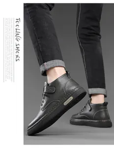 Detail of black winter work boot featuring a velcro ankle strap and thick rubber sole
