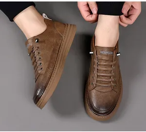 Close-up of brown casual shoes showing textured leather and brand logo on the tongue