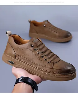 Detail of premium brown leather men's casual shoes with textured finish and metal buckle
