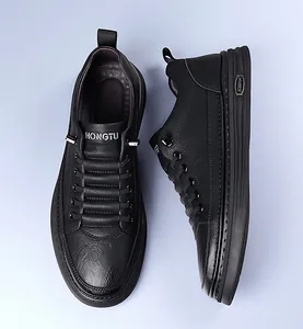 Close-up of black pebble grain leather texture and layered cushioning sole on men's sneaker
