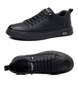 Macro view of men's black casual leather shoes with fine litchi grain and lace-up design
