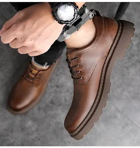 Detailed view of men's brown pebbled leather oxford shoes with thick non-slip soles