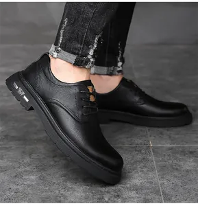 Close-up of black leather men's business shoes featuring litchi grain texture and metal trim