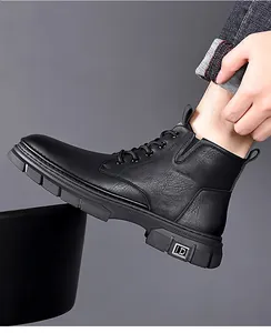 Detail of black leather martin boot with anti-slip thick rubber sole and metallic LD decor
