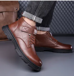 Detail of dark brown high-top boots with textured faux leather and velcro strap