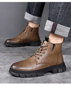 Detail of dark brown leather winter boot with anti-slip rubber sole and metal logo plate