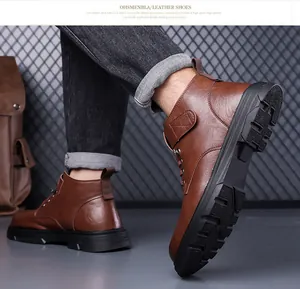 Detailed view of the brown leather men's winter boot featuring a thick anti-slip rubber sole