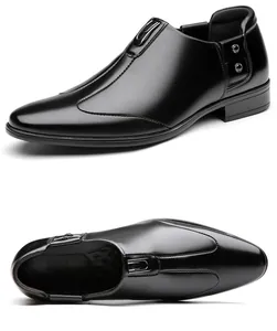 Close-up of black leather business slip-on shoes with metal buckle and stud details
