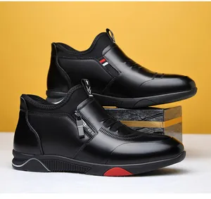 Detail of black winter boots with side zipper, fashion text ribbon and red sole accents