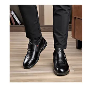 Detail view of black leather winter boots with side zipper and side stripe decorative trim