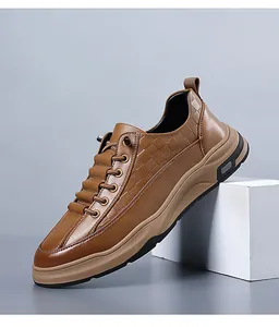 Macro detail of brown leather upper featuring textured embossed grid pattern on the side