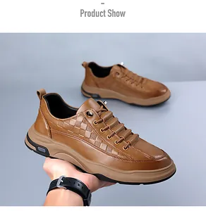 Detailed macro view of the premium brown leather texture and embossed plaid pattern on men shoes