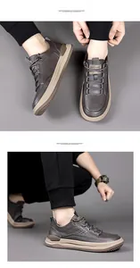 Detail view of men's leather sneakers with dark brown texture and khaki thick soles