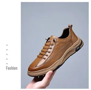 Detailed view of brown leather men's shoe with textured embossing and thick sole