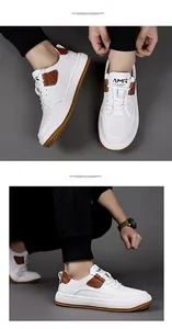 Nahaufnahme von weißen Leder-Sneakern mit braunen Akzenten und Gummisohlendetails
