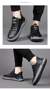 Detail view of men's black leather sneakers featuring gray non-slip thick soles and laces