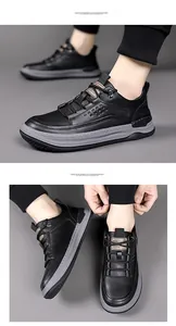 Detail of genuine black leather upper and thick gray sole on men's casual sneakers