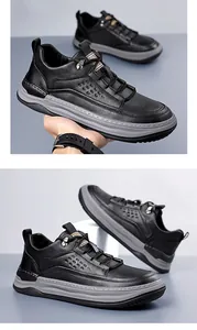 Detail showing litchi texture black leather and perforated side of casual sneakers