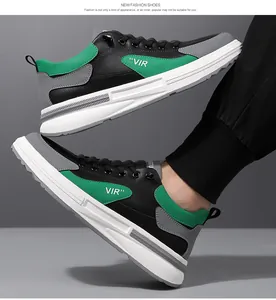 Détail de baskets pour hommes avec touches vertes et empiècements en cuir noir